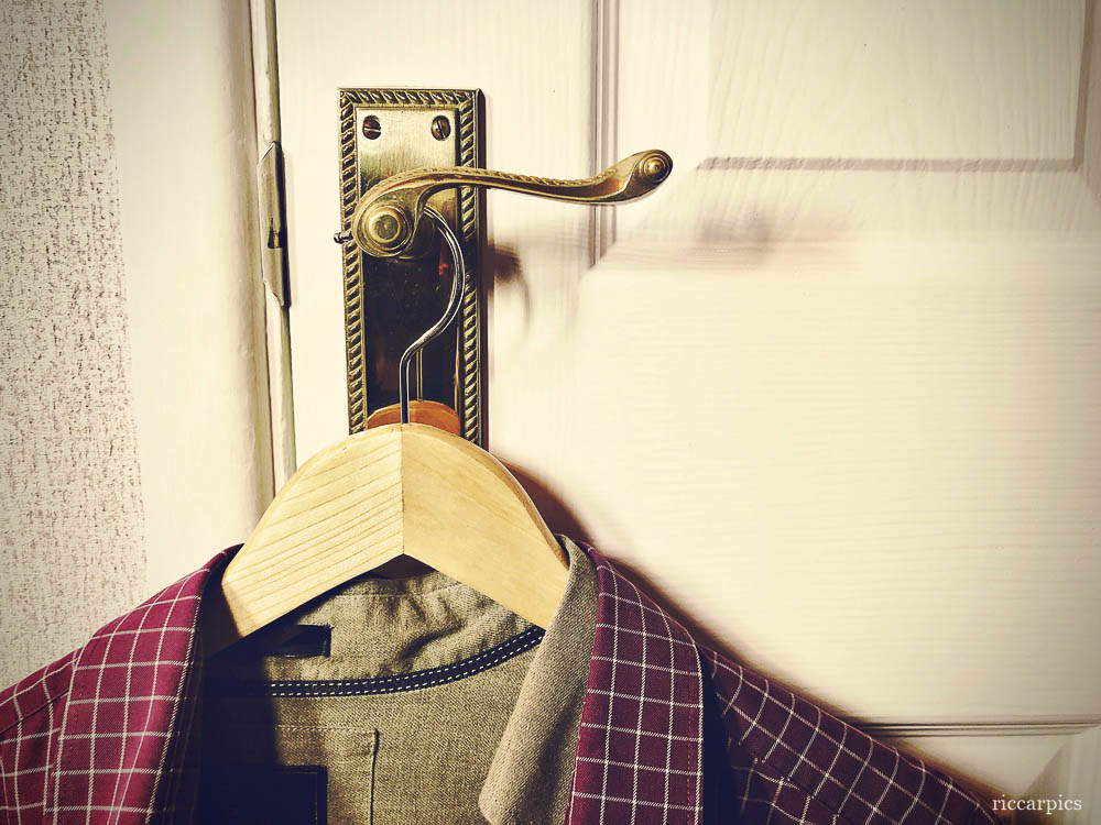 Shirts hanging on a door handle
